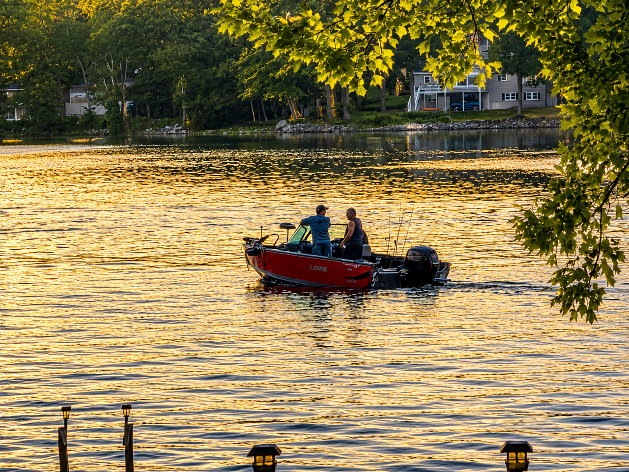 Fishing on Angle Pond NH late day when the fish are likely biting