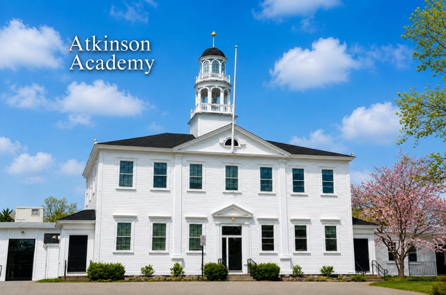 Historic Atkinson Academy in Atkinson, New Hampshire, with its iconic white cupola on a beautiful spring day.