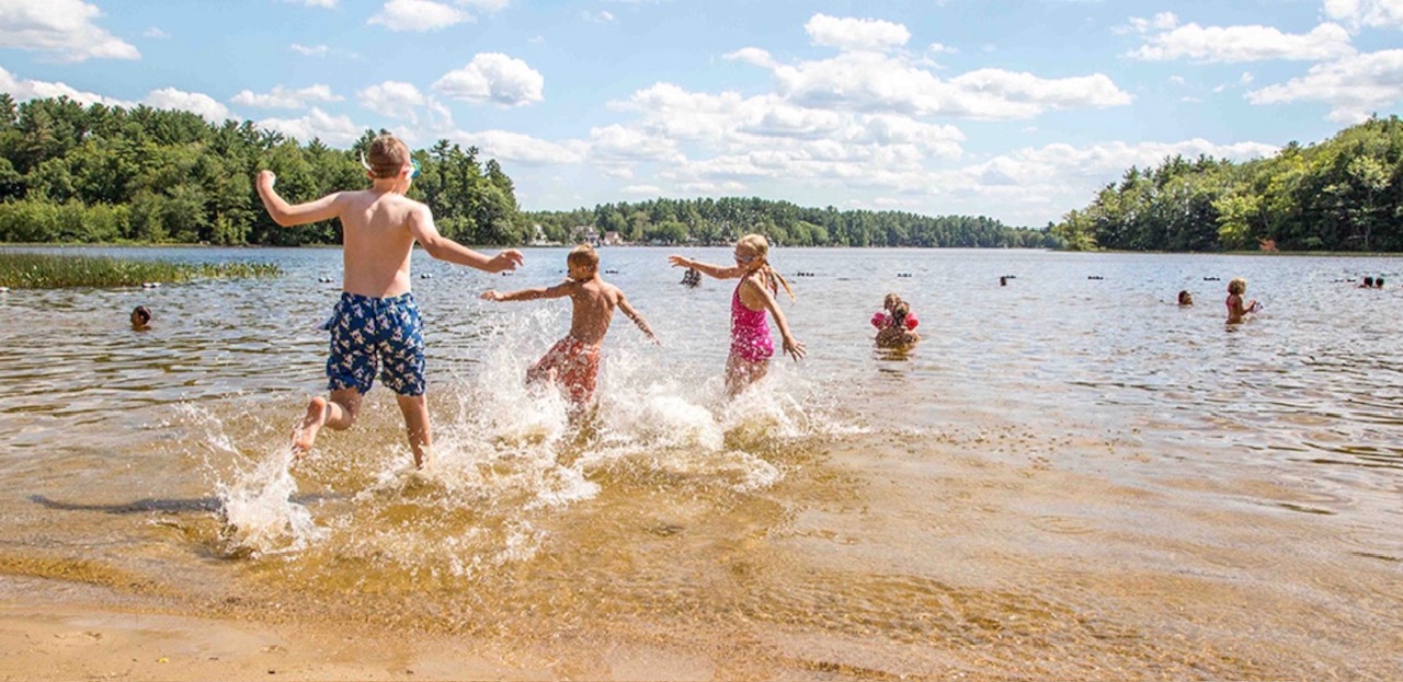 Swimming at the beach at Kingston State Park in Kingston NH on Great Pond